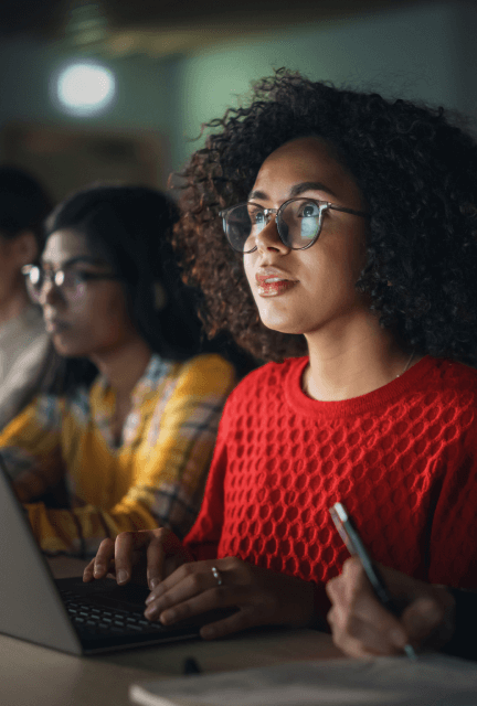 Girl in glasses looking at the web version of the app